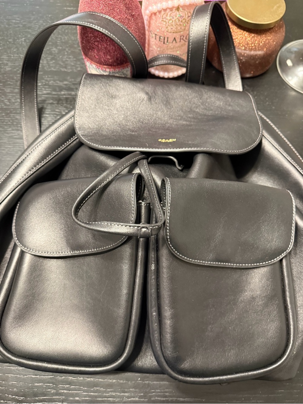 Coach Black Leather Backpack with Dual Front Flap Pockets and Drawstring